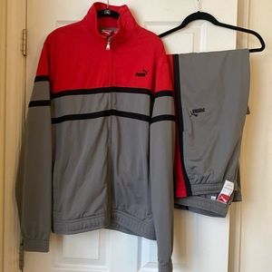 Puma tracksuit used 1X in excellent condition. Pants are medium, jacket is large